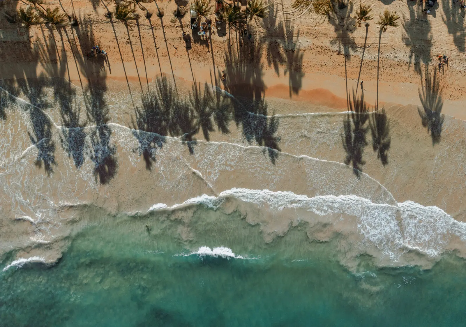 Aerial view of a turquoise bay and a white-sand beach in Phuket, Thailand